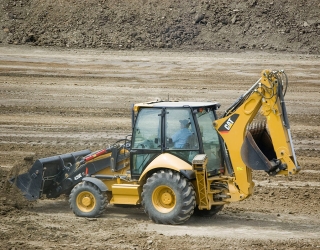 1200px-Backhoe_loader_Cat420E_left